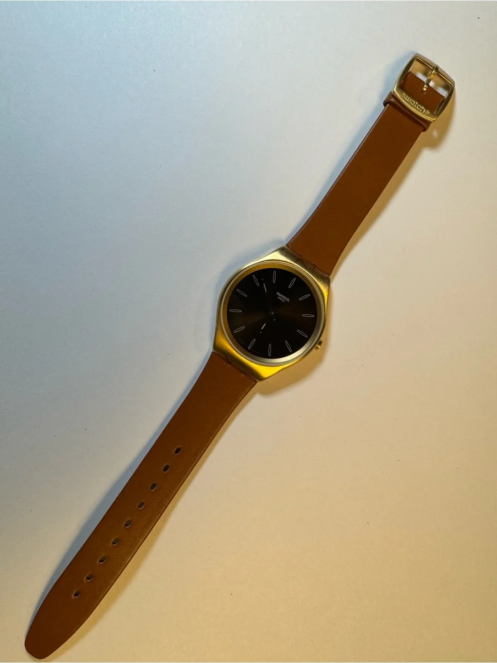 Swatch Skinsand SYXG104 gold-tone and leather analog watch